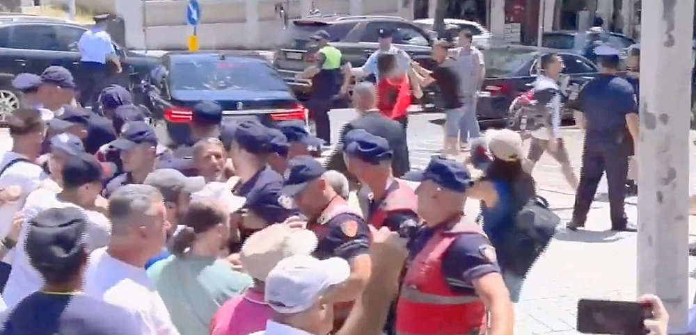 A protester throws an egg at an MP's car, Tirana, Albania, June 2026