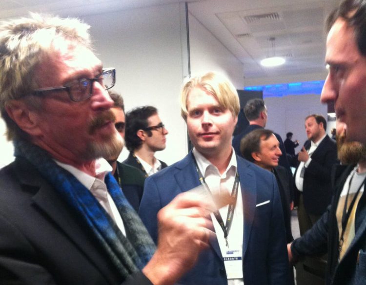 McAfee (left) at the blockchain money conference in London 2016