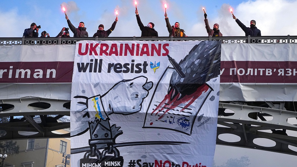Ukrainians attend a rally in central Kyiv, Ukraine, Saturday, Feb. 12, 2022