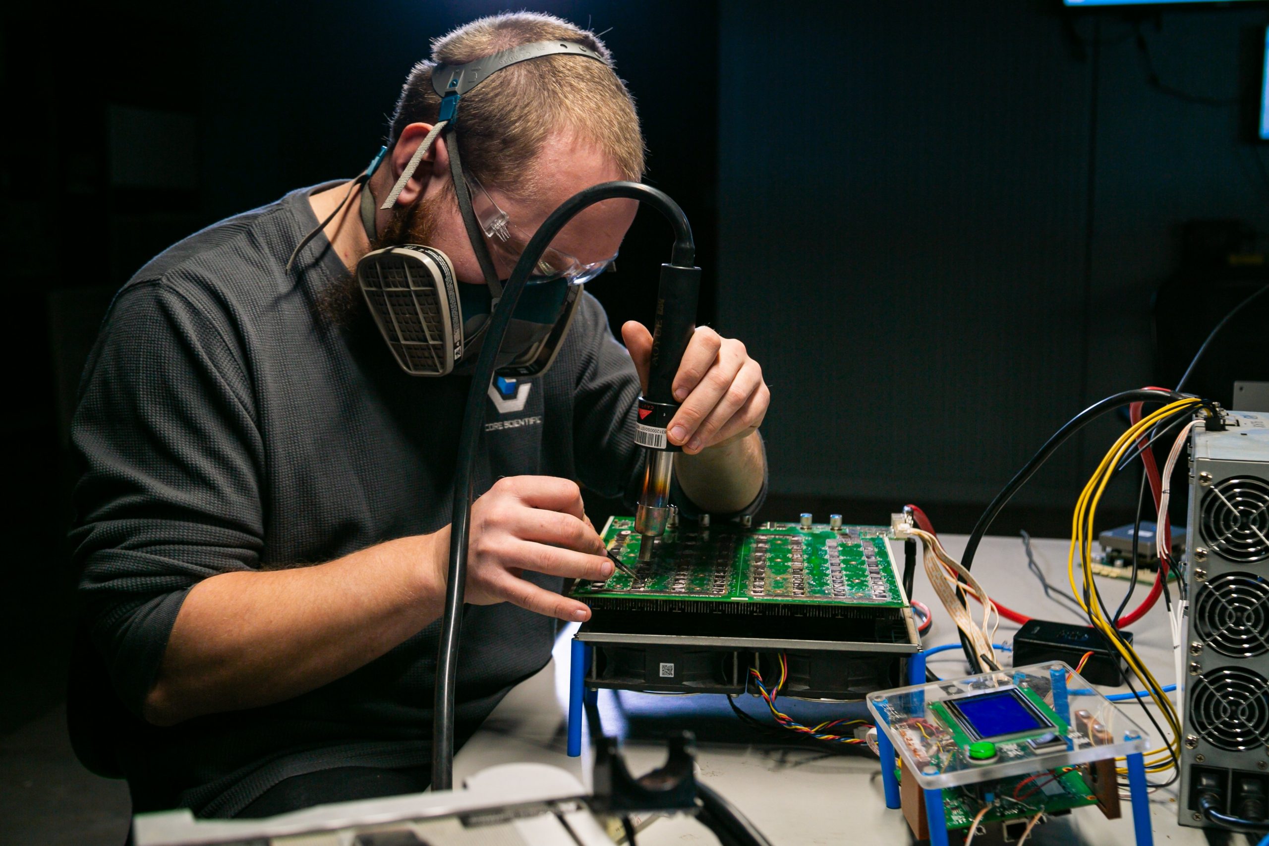 A Core Scientific engineer playing with chips, Oct 2022